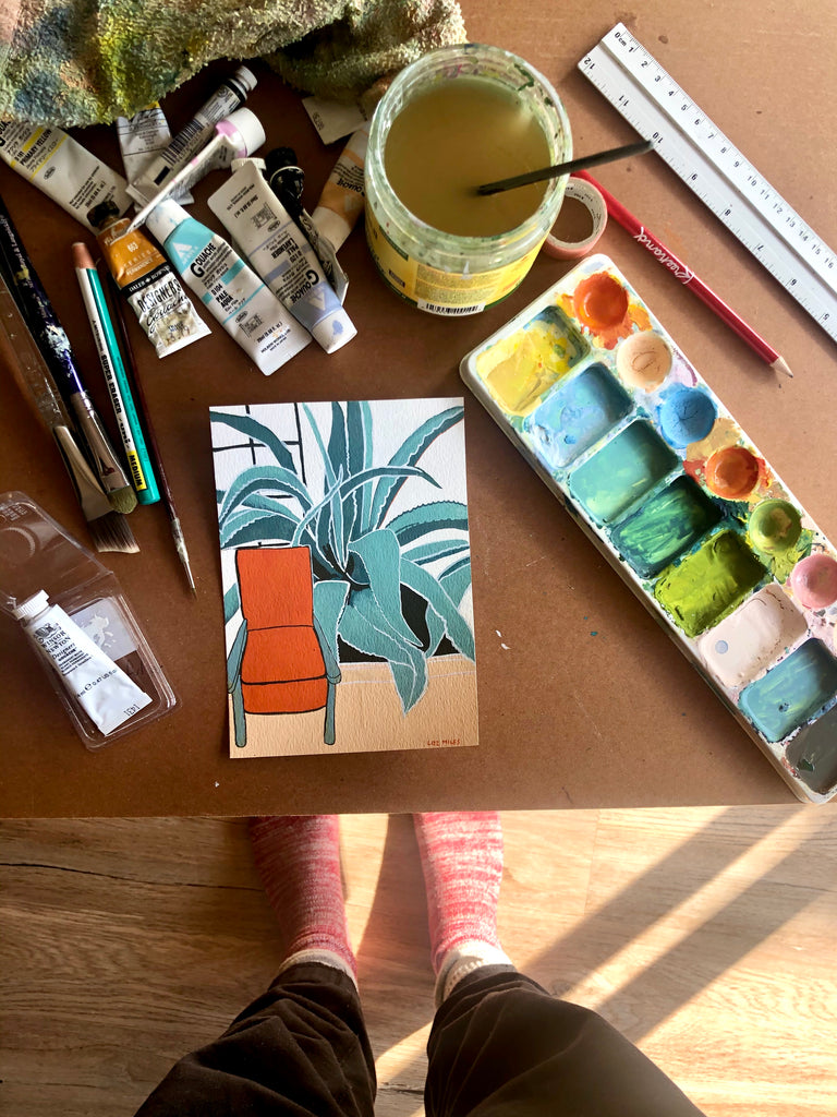 photograph of original painting of chair infront of agave plant